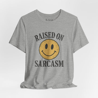 Raised on Sarcasm Smiley Tee