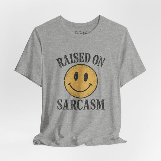 Raised on Sarcasm Smiley Tee