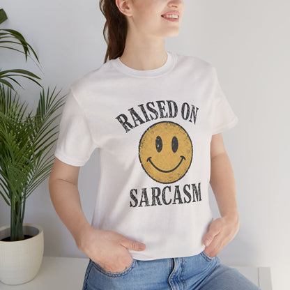 Raised on Sarcasm Smiley Tee